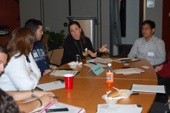 Joy McKenna, president, Research Management Corporation, gesturing to the students