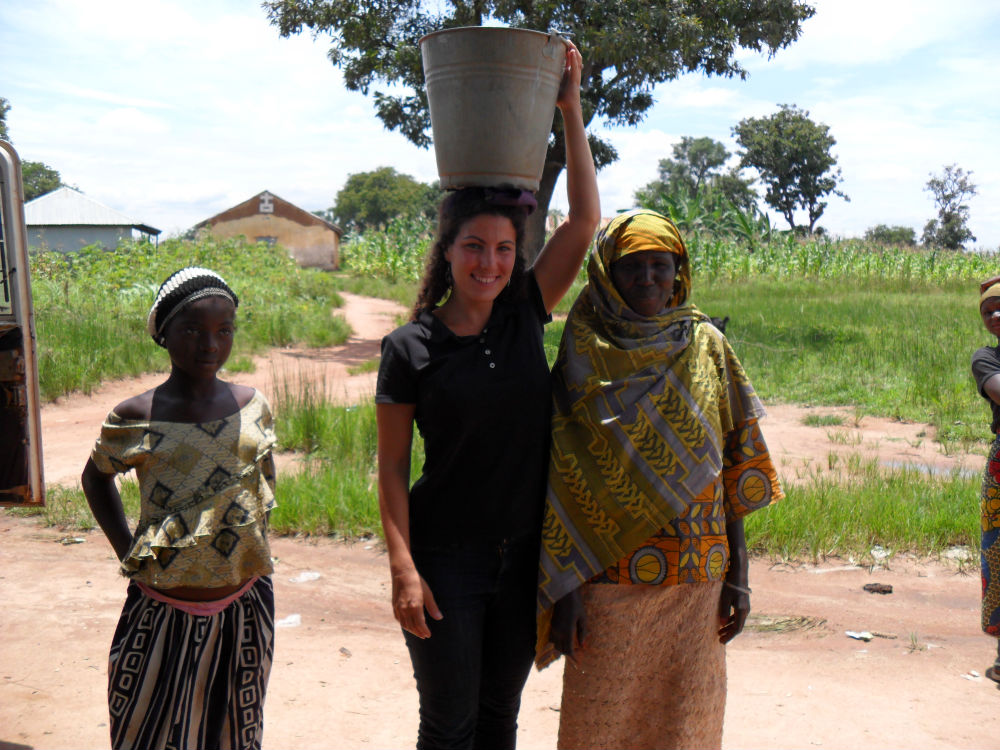 Trying to carry a bucket on my head—it’s harder than it looks!