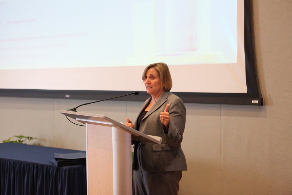 Joyce J. Elam presented awards from graduates as well as the research and service awards.