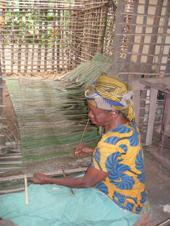 A woman in a nearby community makes the roof of a new section of their home out of palm leaves and bamboo stalks. She showed me how to do this and couldn't stop laughing at how slow I was!