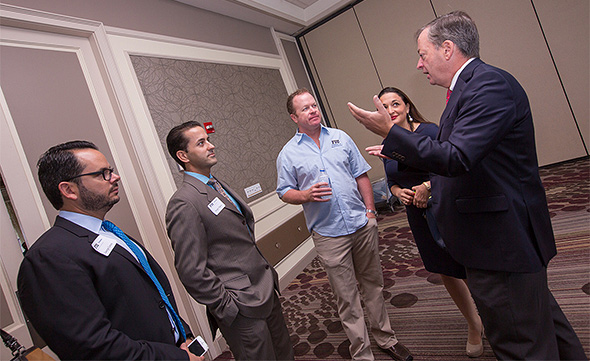 George Croton, Sergio Tigera, Chad Moss, Suzanne Hollander, and William Hardin chat during the 2015 Hollo School of Real Estate Jerome Bain Developer Luncheon