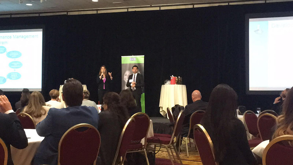 College of Business students Leslie Cambria and Ricardo Arcentales make their case presentation at the 2016 SHRM Student Case Competition