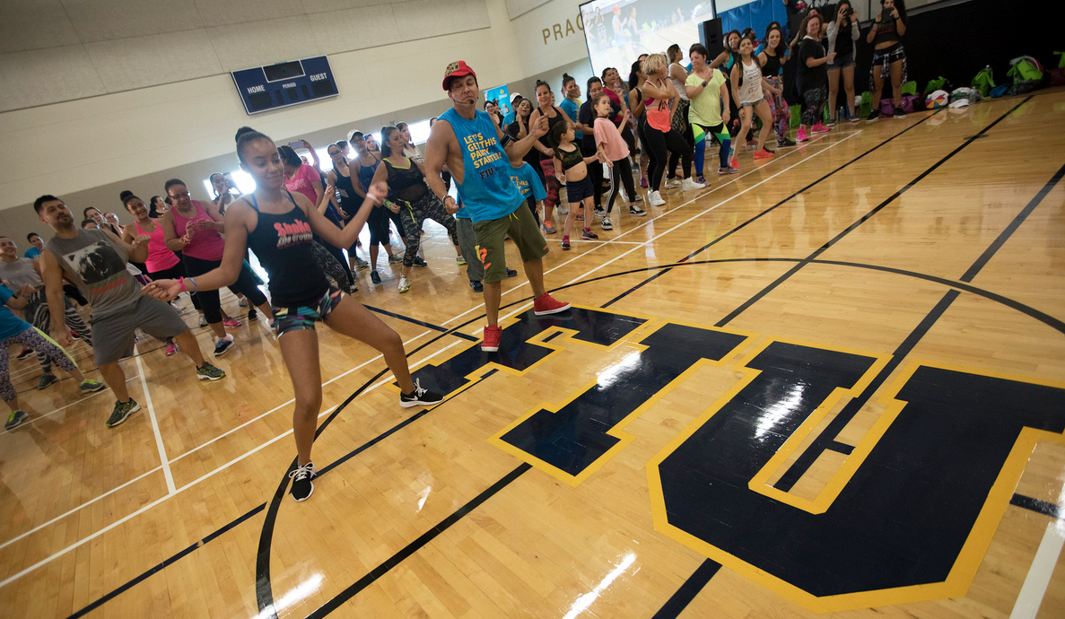 Zumba co-founder Beto Perez stages a dance-out for College of Business charity.