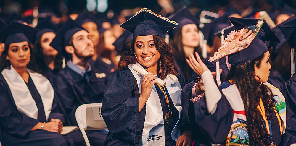 Staff members add a new degree to their accomplishments.