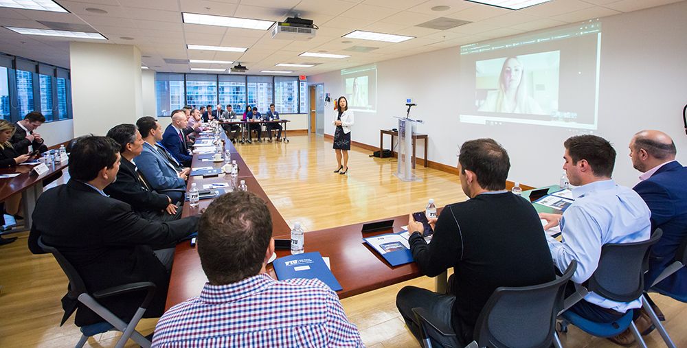 Dean Joanne Li speaks to Hollo board members