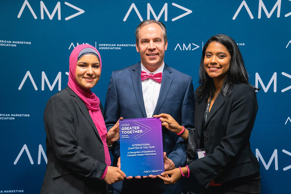 L. to r.: AMA FIU Co-President Naimeh Harami, Professor Tim Birrittella, and Co-President Karla Rosario. 