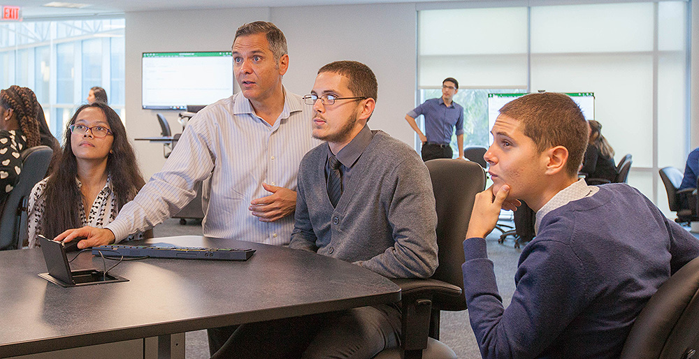 Flavio Carrillo with financial literacy program students