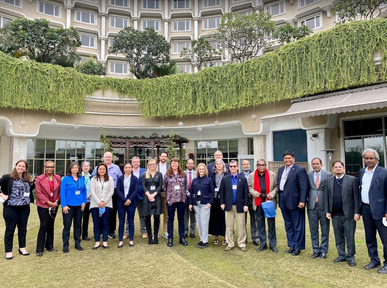 The group poses at their hotel, The Taj Palace in Delhi